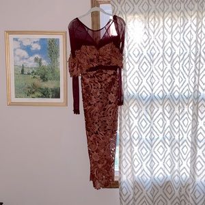 Never worn, tags still on beautiful dress by three floor, size 2